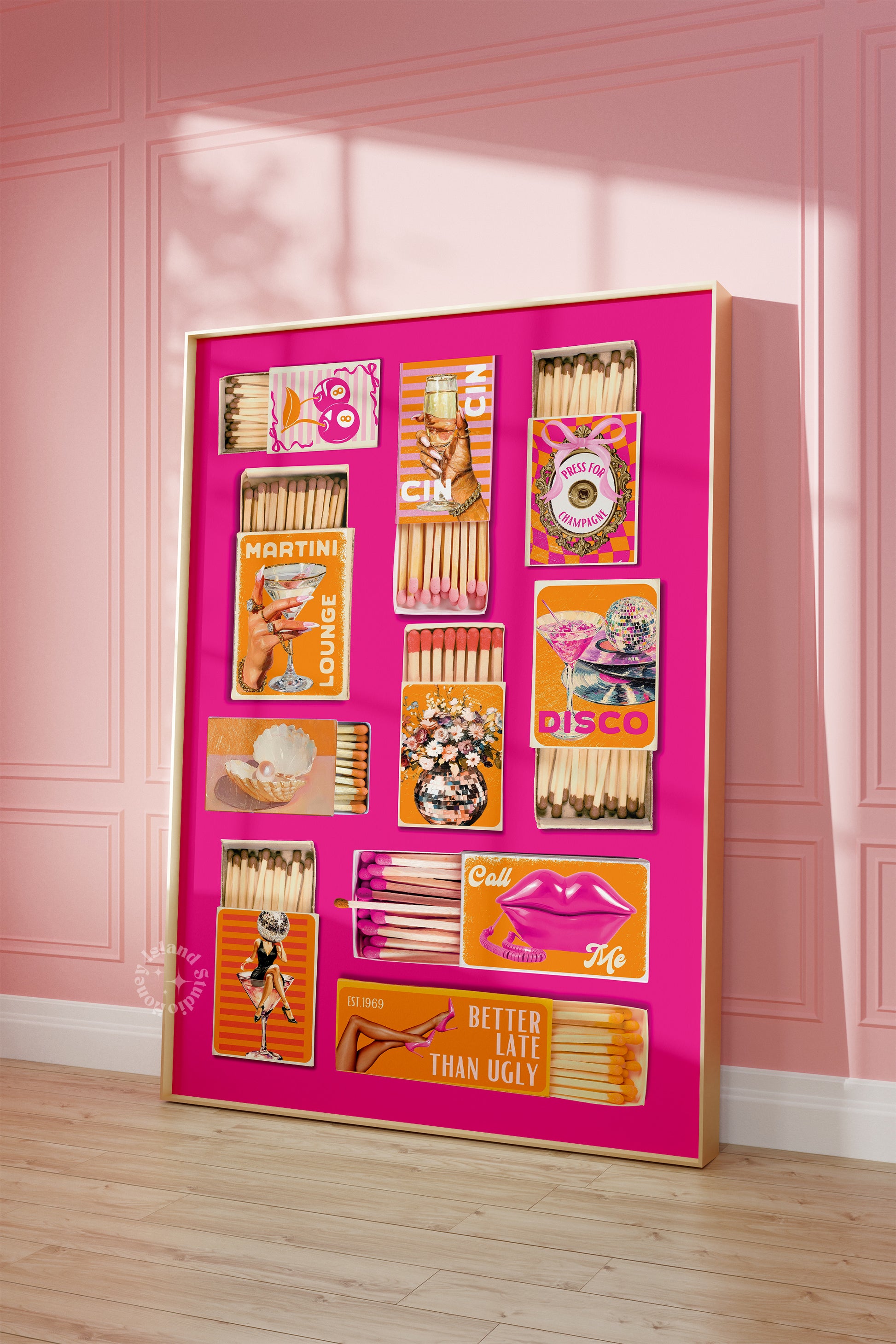 Collection of vintage matchbooks in a decorative frame against a pink wall.