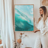 woman holding wave art print framed