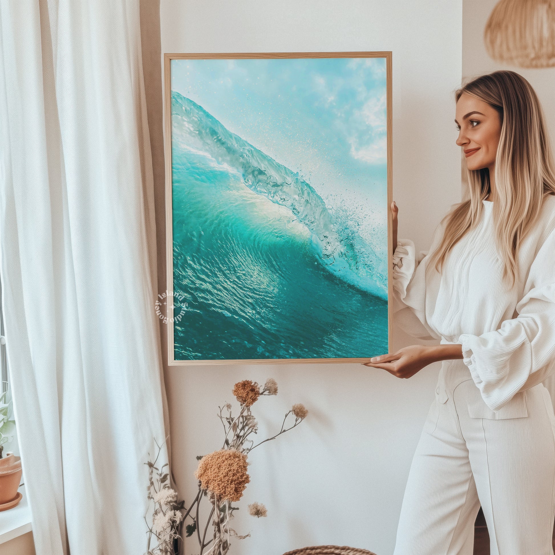 woman holding wave art print framed